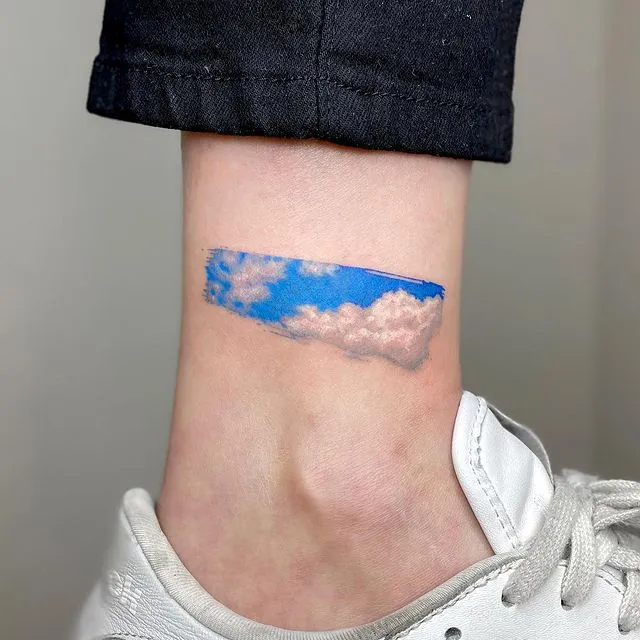 **Blue Sky Peek Tattoo**