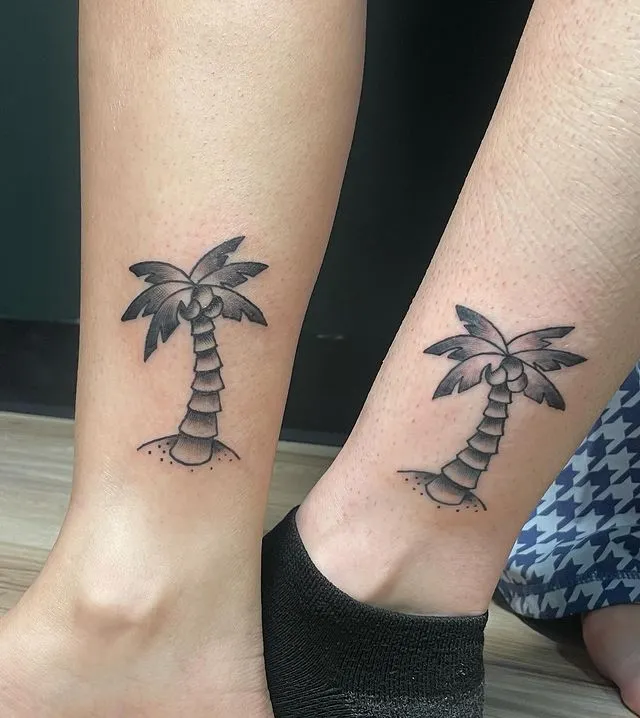 **Charming Twin Palms Tattoo**