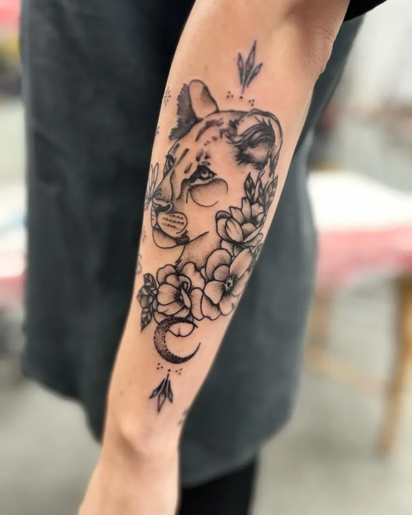 **Floral Accent Lioness Tattoo**