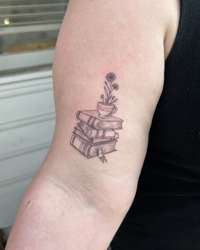 **Floral Book Stack Tattoo**