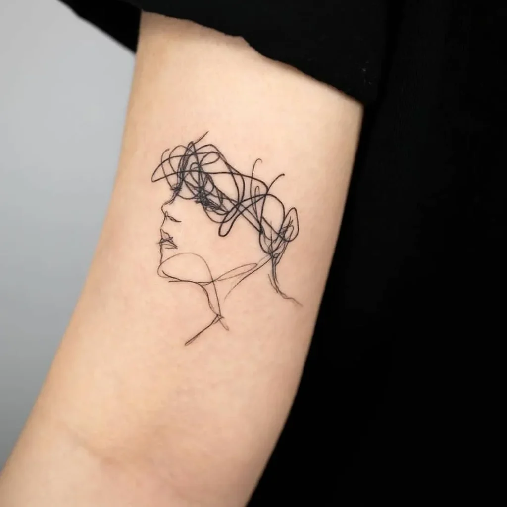 ### Scribbled Silhouette Tattoo