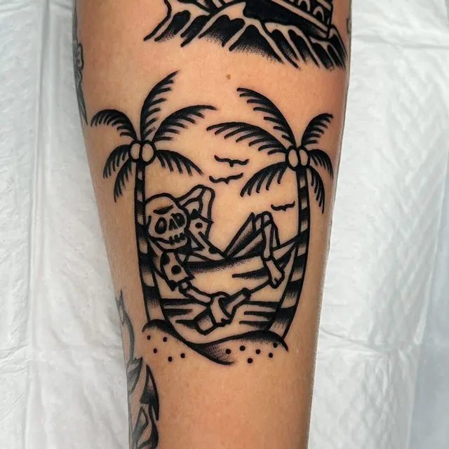 **Skeleton Chilling Under Palms Tattoo**