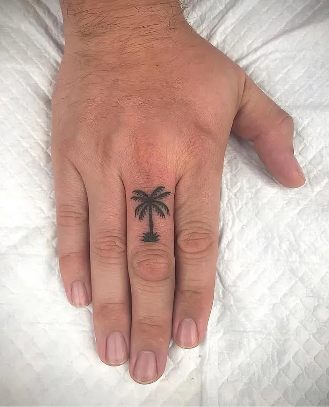 ### Tiny Palm on Finger Tattoo