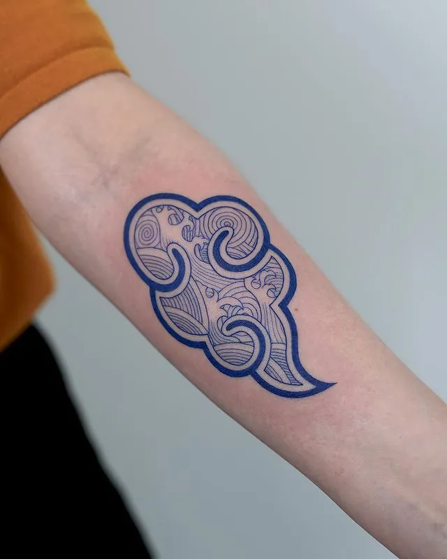 ### Whimsical Swirl Cloud Tattoo