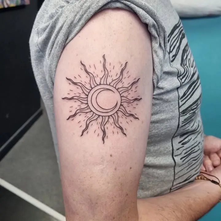 **Celestial Embrace Sun Tattoo**