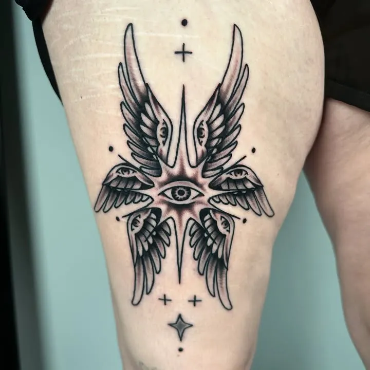 ### Celestial Eye Wings Tattoo