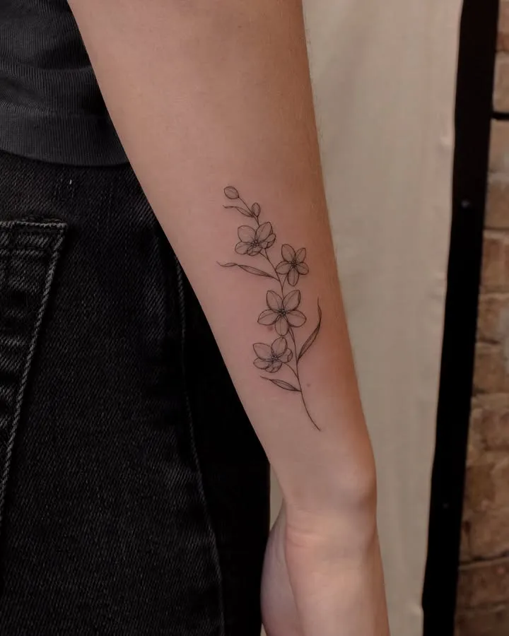 **Delicate Blossom Trail Tattoo**