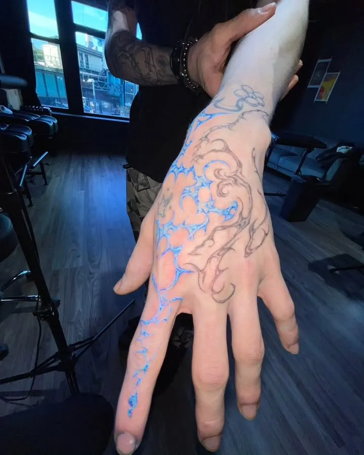 ### Electric Veins Hand Tattoo