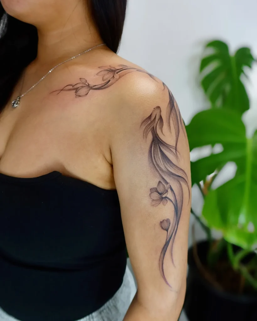 ### Elegant Flowing Koi Tattoo