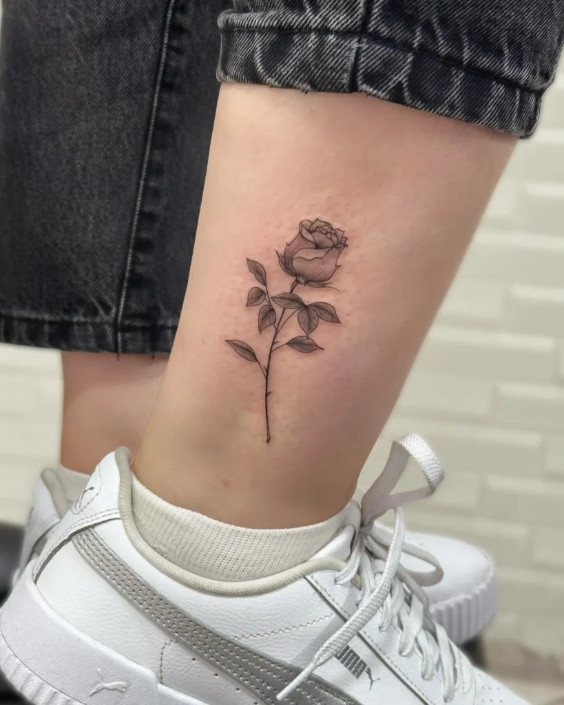 **Graceful Rose Stem Tattoo**