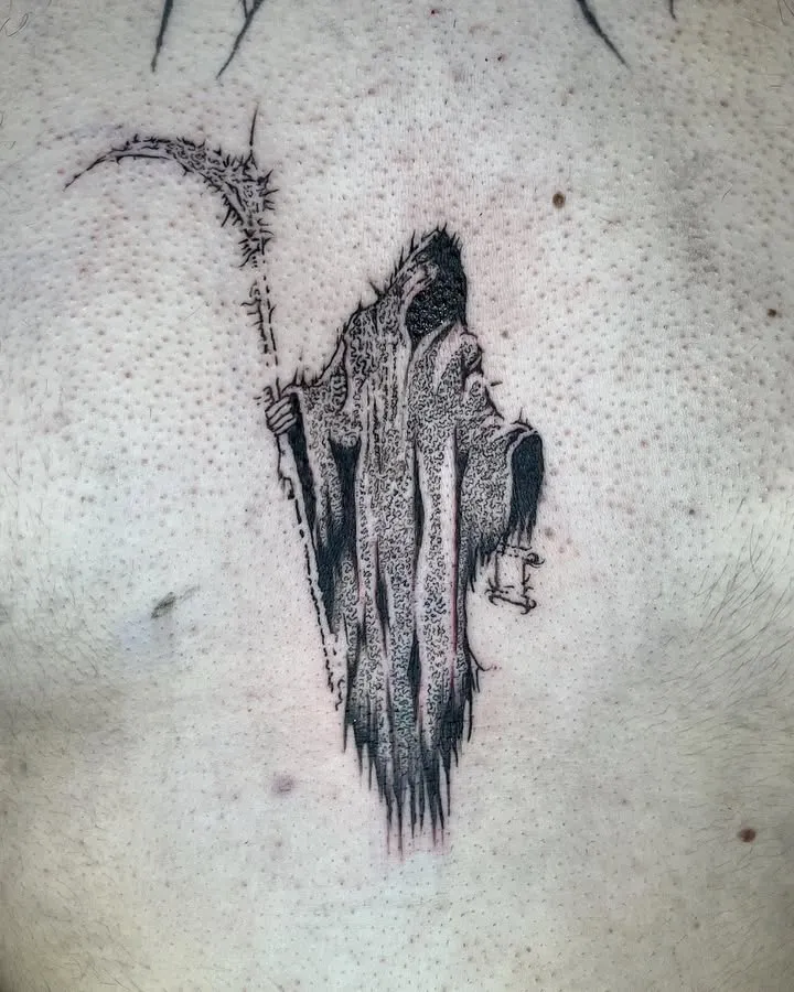 **Mystical Hooded Figure Tattoo**