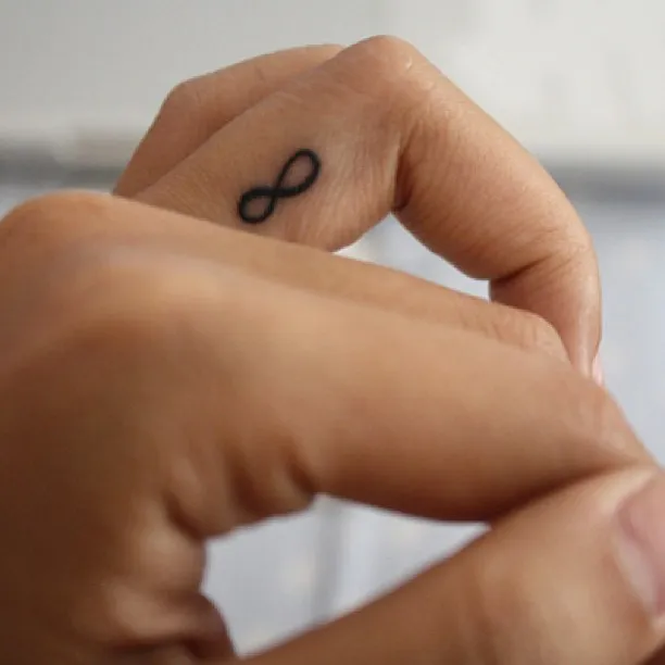 ### Tiny Infinity Finger Tattoo