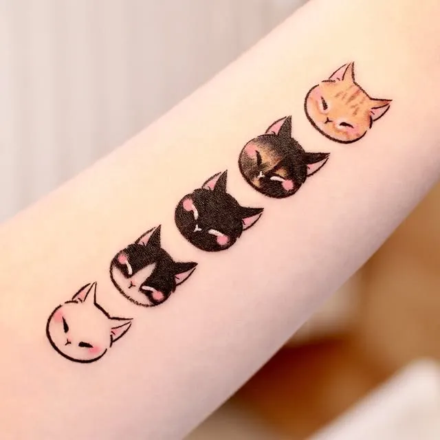 Adorable Cat Faces Tattoo