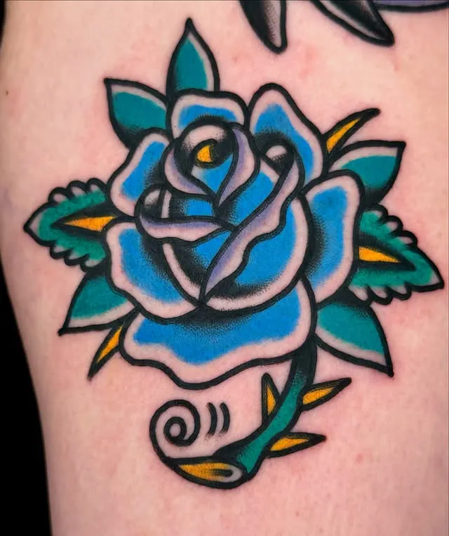 ### Bold Blue Bloom Tattoo