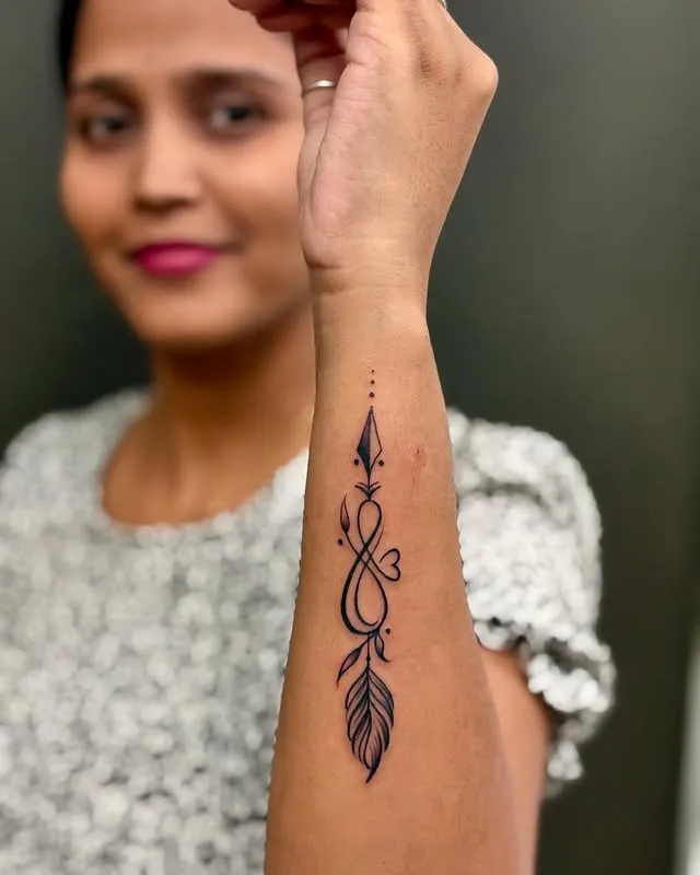 Delicate Feather Arrow Tattoo