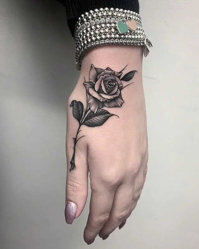 # Delicate Hand Rose Tattoo