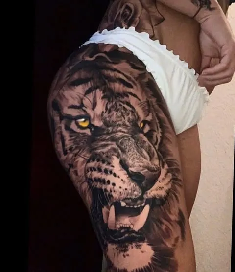 Fiery Lion Gaze Tattoo