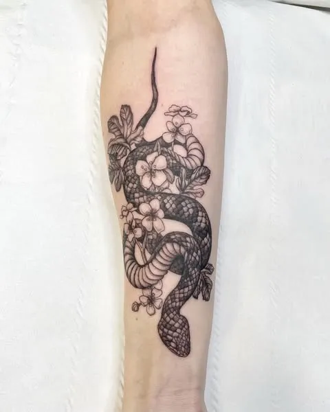 **Floral Serpent Elegance Tattoo**