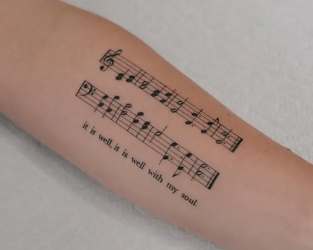 Music Notes Arm Tattoo