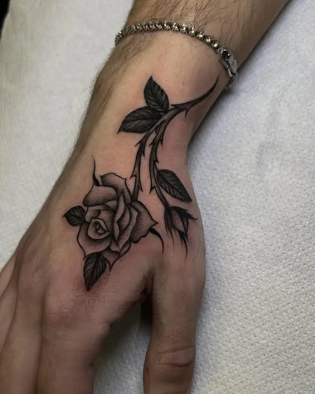 **Rose Adorned Hand Tattoo**