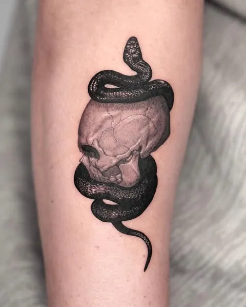 Serpent Wrapped Skull Tattoo